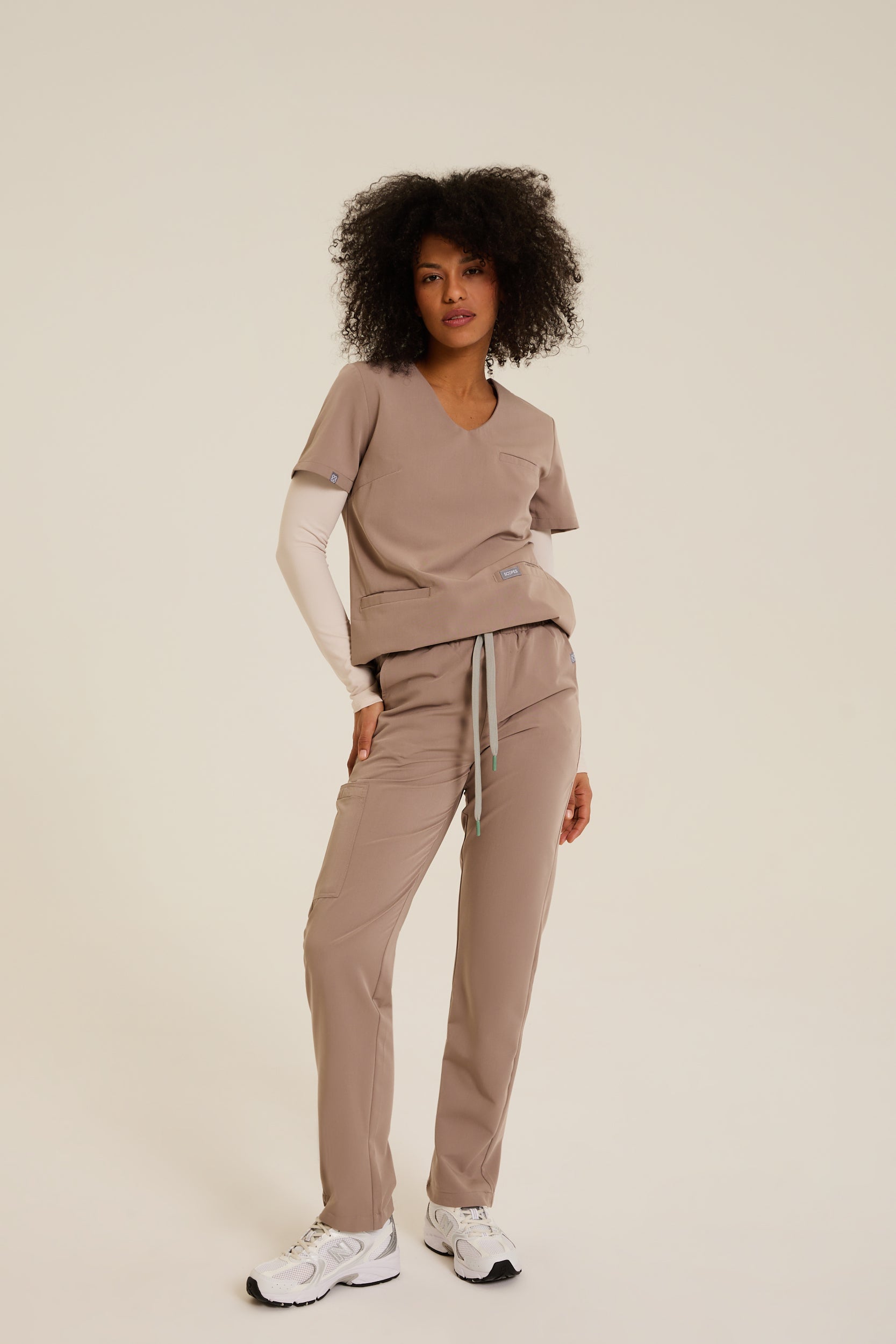 Women wearing beige medical scrubs
Beige scrubs for women
Women’s beige healthcare scrubs