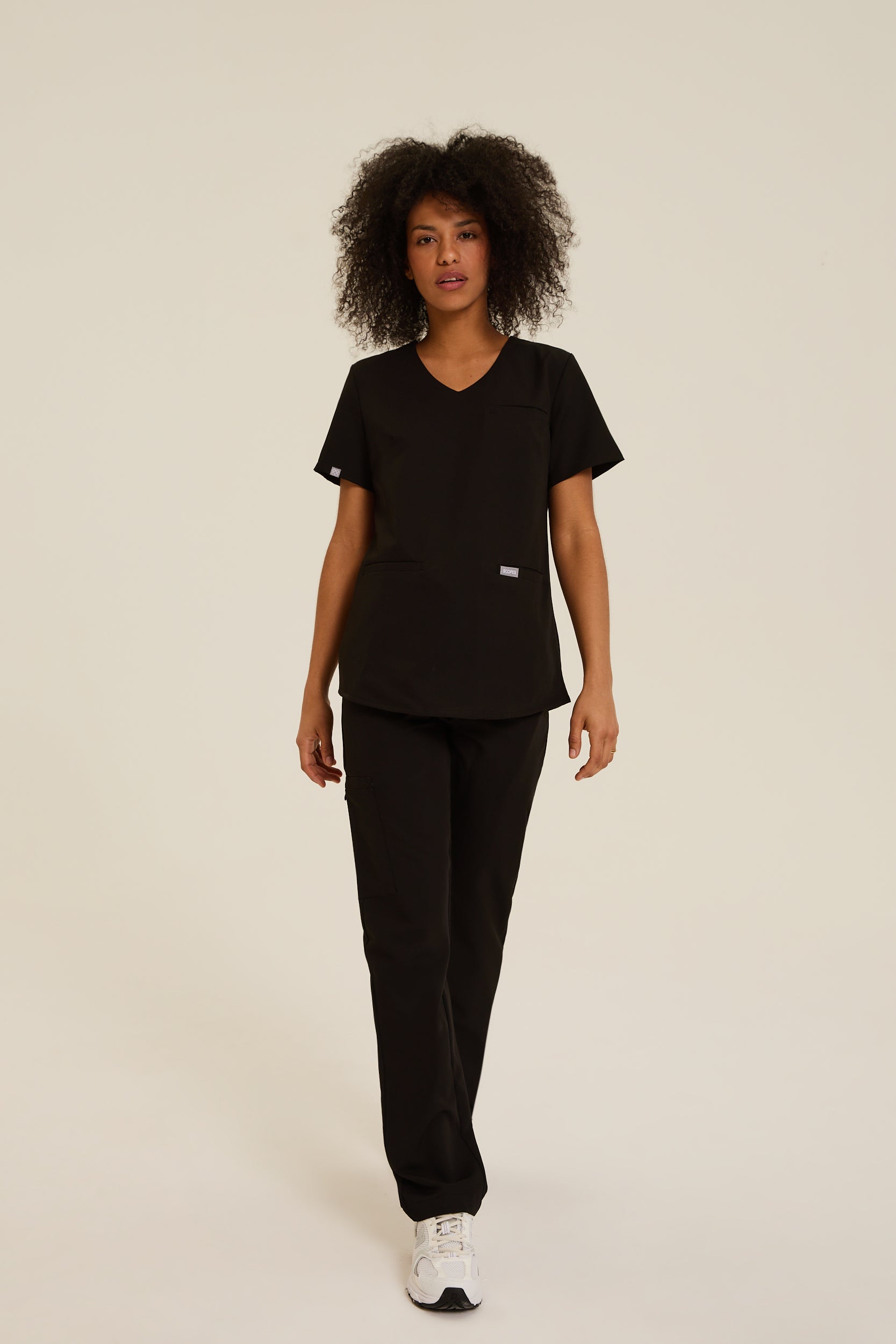 Women wearing black medical scrubs
Women’s beige scrubs for healthcare professionals
black women’s medical scrubs for hospital and clinic use