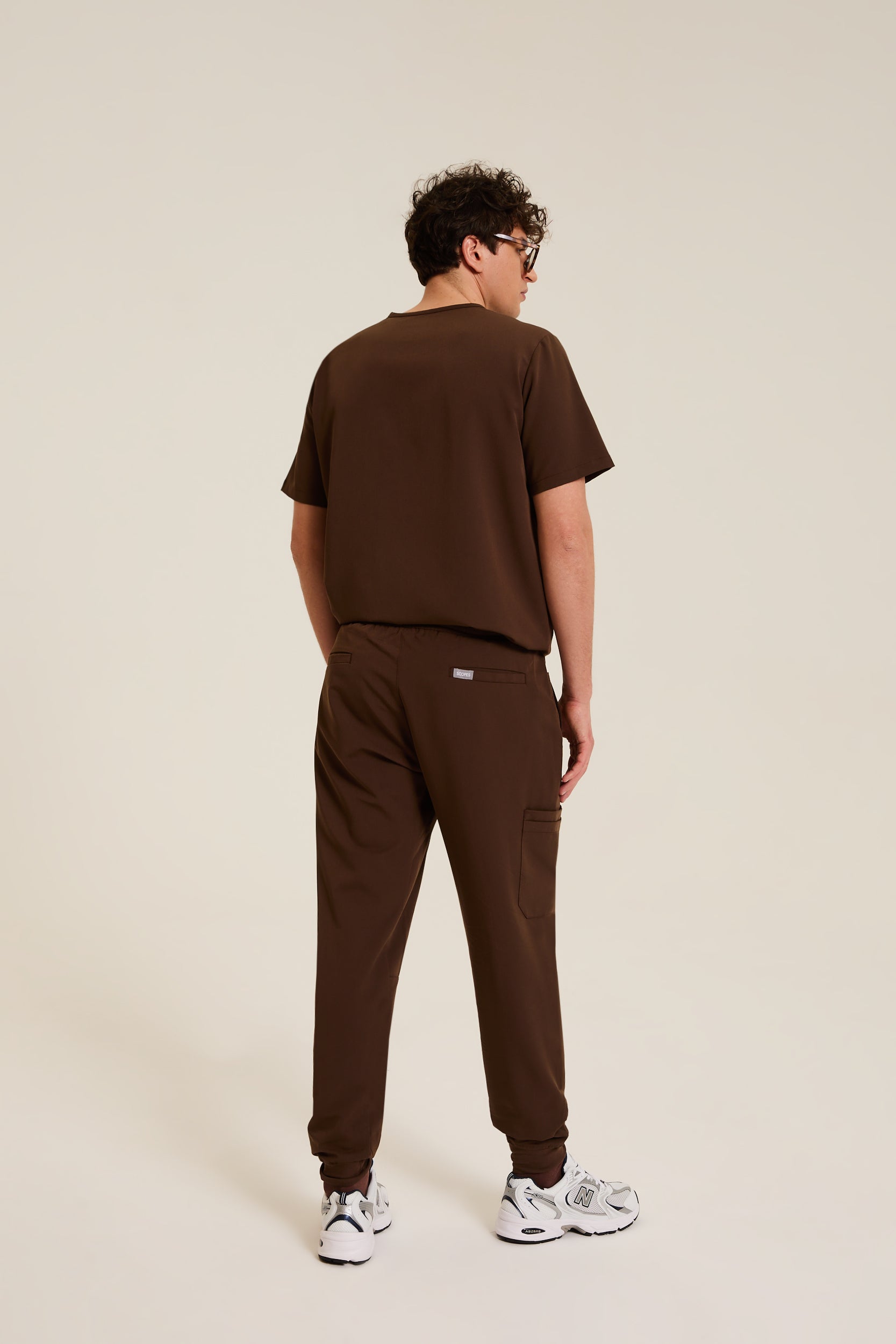 Men wearing brown medical scrubs with comfortable fit
Men’s brown medical scrubs designed for clinical environments
Professional brown scrubs for men