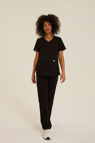 Women wearing black medical scrubs
Women’s beige scrubs for healthcare professionals
black women’s medical scrubs for hospital and clinic use