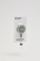 White synthetic ID badge holder with SCOPES logo and metal clasp